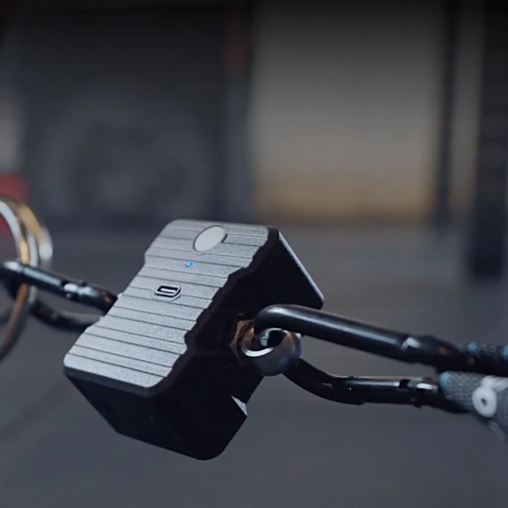 A CableMate sensor clipped inline on a cable machine attachment